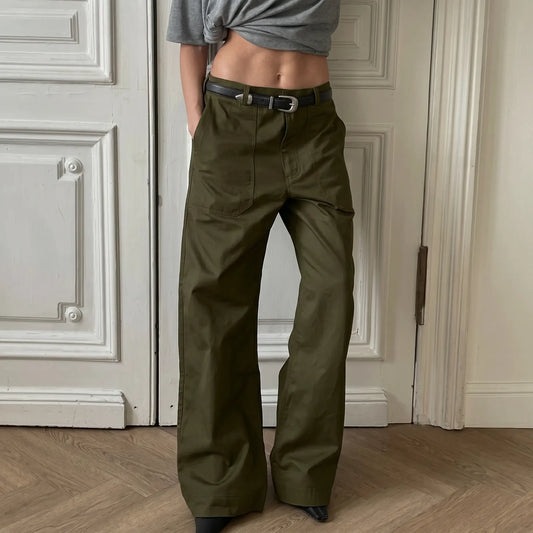 Model wearing Kaelen olive green wide-leg utility trousers with a high-rise fitted waistband, zip fly, and front patch pockets. The full-length trousers have a relaxed straight leg silhouette and are shown in a studio setting.