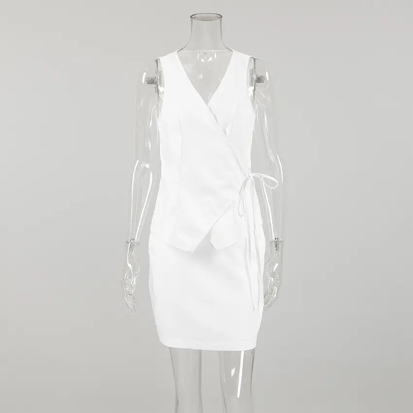 Kaelen white sleeveless wrap top and A-line mini skirt set featuring a V-neckline and side tie closure for an elegant summer ensemble.