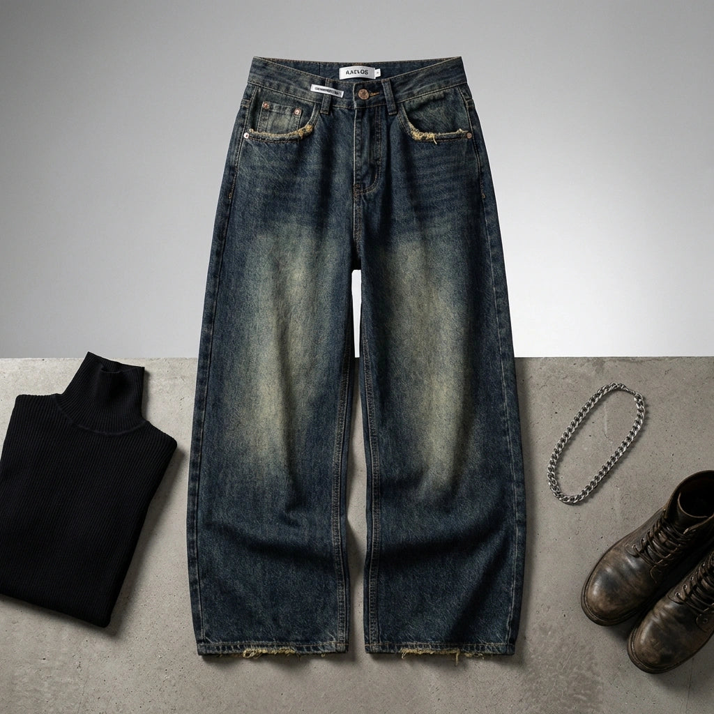 Kaelos high waisted wide leg jeans in vintage wash denim, flat lay styling with black turtleneck and leather boots.