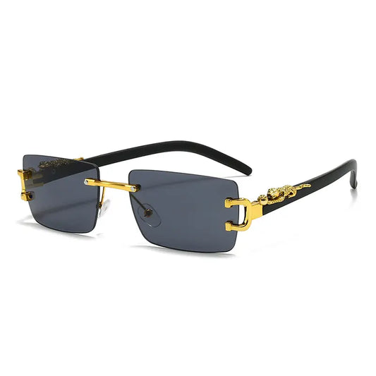 Kaelos rimless square sunglasses with gradient grey lenses and gold leopard detail on matte black temples. Features gold bridge and adjustable nose pads.