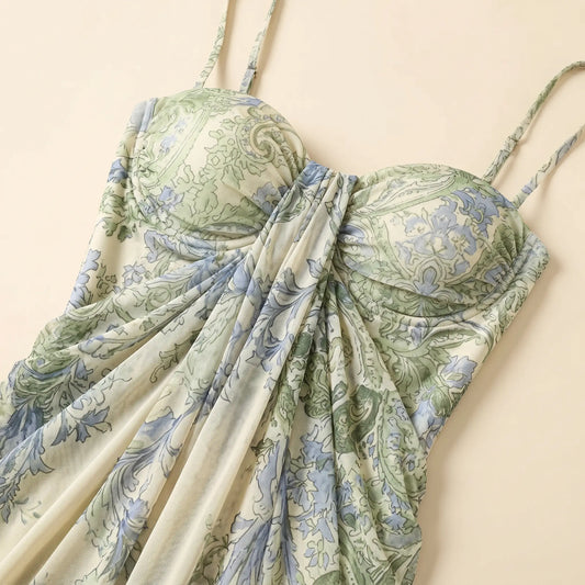 Close-up of a Zenthos green and blue botanical floral mesh maxi dress, showcasing the gathered sweetheart bodice, spaghetti straps, and ruched fabric.