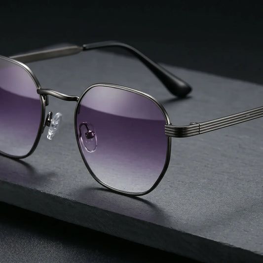 Close-up of Miroku octagonal metal frame sunglasses with gradient purple lenses and ribbed gunmetal grey temple arms featuring black acetate tips.