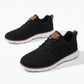 Aerostride Men's Breathable Knit Sneakers in black mesh with brown vegan leather accents — pair view showing the cushioned white sole.