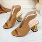 Aethel women's peep-toe block heel sandals in rich brown, featuring intricate woven texture and a metallic chain ankle strap shown from a three-quarter angle.