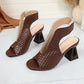 A pair of deep chestnut brown peep-toe block heel sandals with a distinctive woven texture and geometric heel, shown from a three-quarter angle.