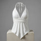 Off-white viscose-elastane blend halter neck camisole top featuring a deep V-neckline, cinched peplum waist, and asymmetrical handkerchief hem, displayed on a studio pedestal.