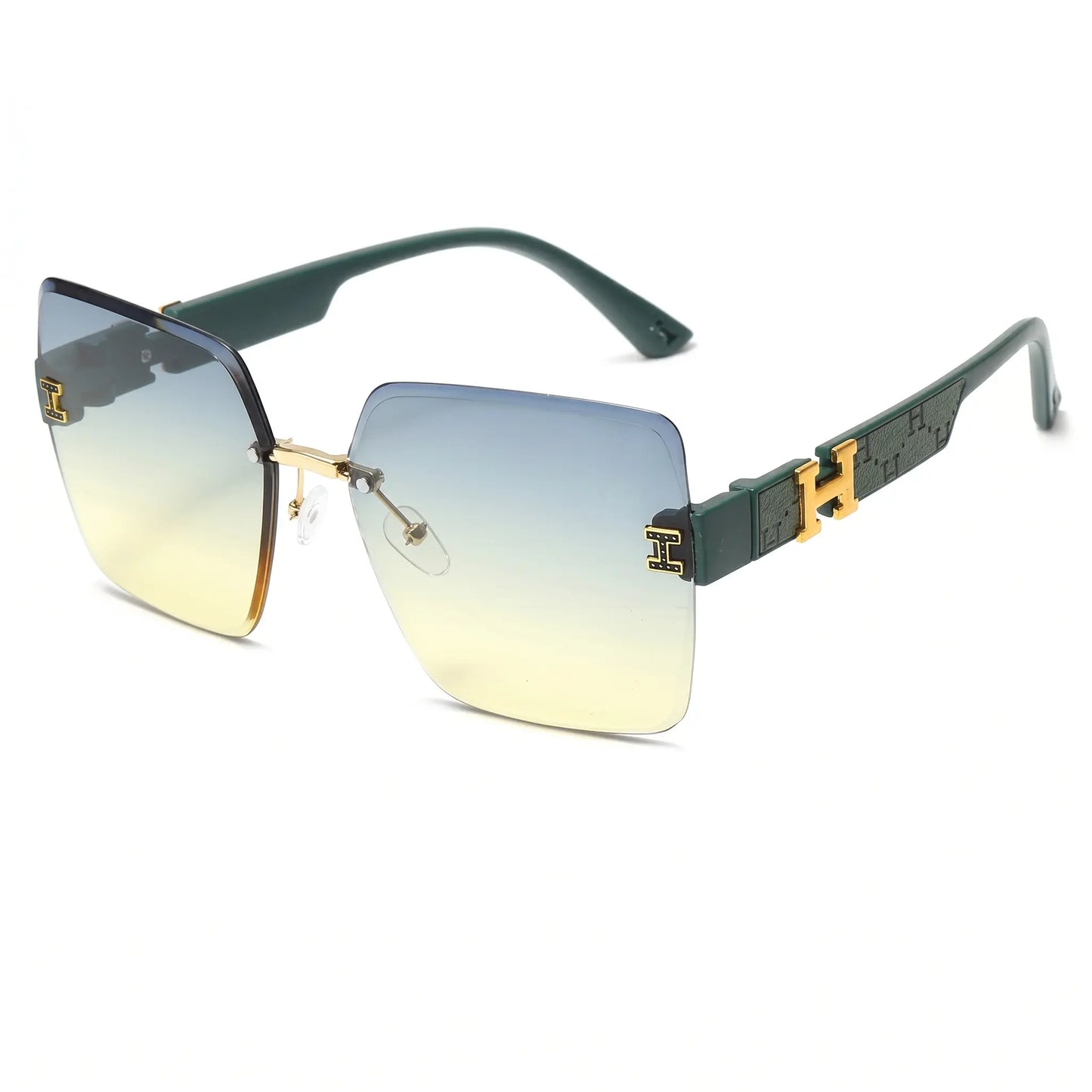 Aethel oversized square rimless sunglasses with gradient blue-to-yellow lenses and dark green temples featuring gold 'H' logo accents and a gold bridge.