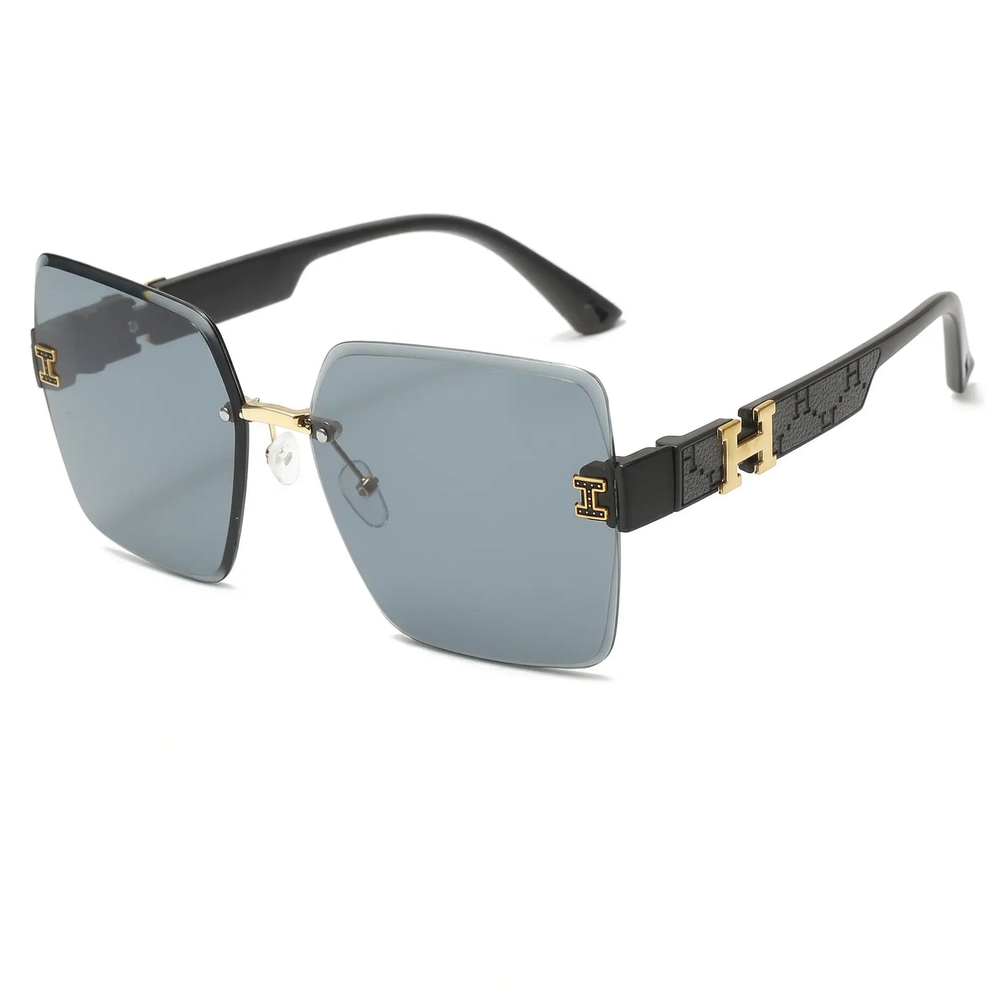 Oversized rimless square sunglasses with grey gradient lenses and black temples featuring gold-tone 'H' logo accents. These fashion eyewear pieces offer UV400 protection and a chic, bold silhouette.
