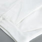Close-up detail of the premium white viscose blend fabric for Aethel's two-piece set, showcasing stitching and subtle texture.