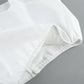 Close-up of white fabric with neat stitching and a visible zipper, showcasing the quality craftsmanship of the Aethel two-piece set.