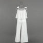 Back view of the Aethel white strapless ruffle crop top and high-waisted wide-leg trousers set, displayed on a mannequin against a studio background.