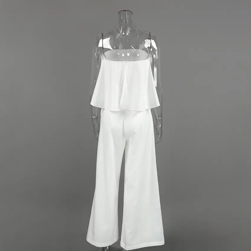 Back view of the Aethel white strapless ruffle crop top and high-waisted wide-leg trousers set, displayed on a mannequin against a studio background.