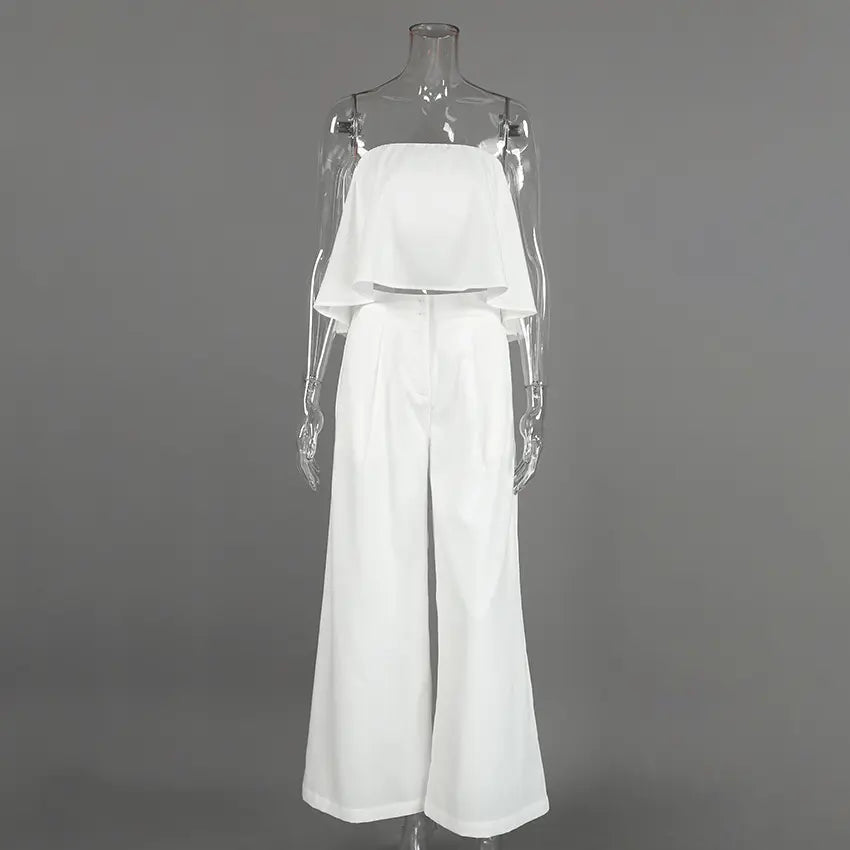 Aethel white strapless ruffle crop top and high-waisted wide-leg trousers set displayed on a mannequin, front view.
