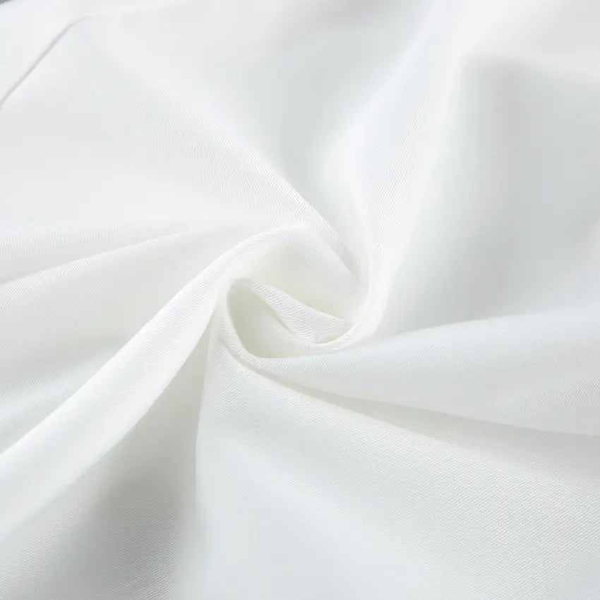 Close-up view of the luxurious off-white viscose blend fabric, showcasing its subtle texture and elegant drape, ideal for sophisticated apparel.