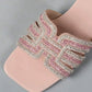 Close-up view of Ayori rhinestone flat slides in blush pink, showcasing intricate embellishments on the single band strap and the square toe silhouette. Subtle padding is visible on the footbed.