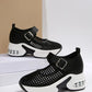 Baxar women's black breathable mesh sneakers featuring a Mary Jane-style adjustable buckle strap, a white platform sole, and a translucent air cushion heel.