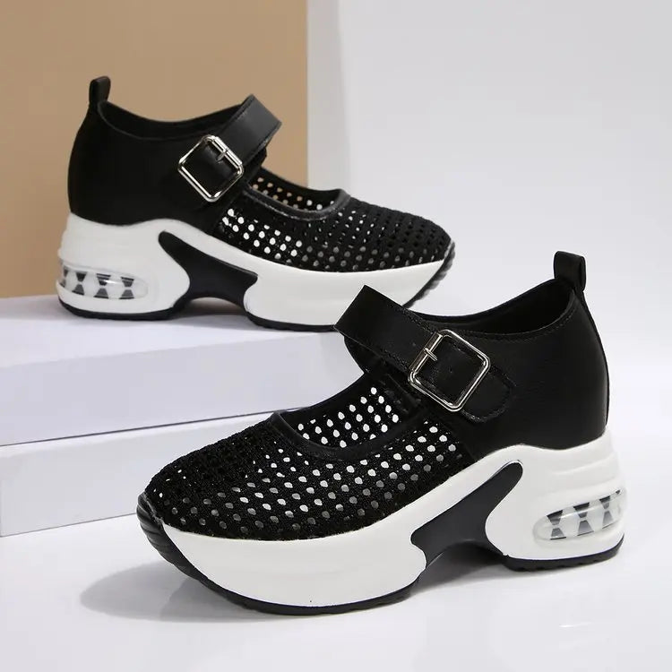 Baxar women's black breathable mesh platform sneakers with a silver buckle strap and translucent air cushion heel, shown from a three-quarter angle.