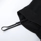 Black camisole detail featuring an adjustable spaghetti strap and the seam where the ruched satin-look bust meets the sheer chiffon lower panel.