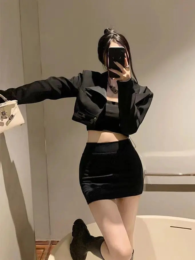 Model showcasing a black high-waisted bodycon mini skirt, featuring a form-fitting silhouette, smooth knit, and wide seamless waistband.