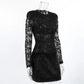 Elegant black lace mini dress with long sheer sleeves and a plush faux fur skirt, displayed on a mannequin from a three-quarter view.