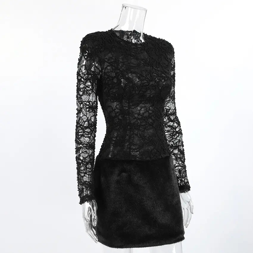 Elegant black lace mini dress with long sheer sleeves and a plush faux fur skirt, displayed on a mannequin from a three-quarter view.