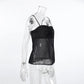 Black sheer camisole top on a mannequin, featuring a ruched satin-like bodice and thin adjustable spaghetti straps. The lower portion is made of delicate, translucent chiffon fabric.