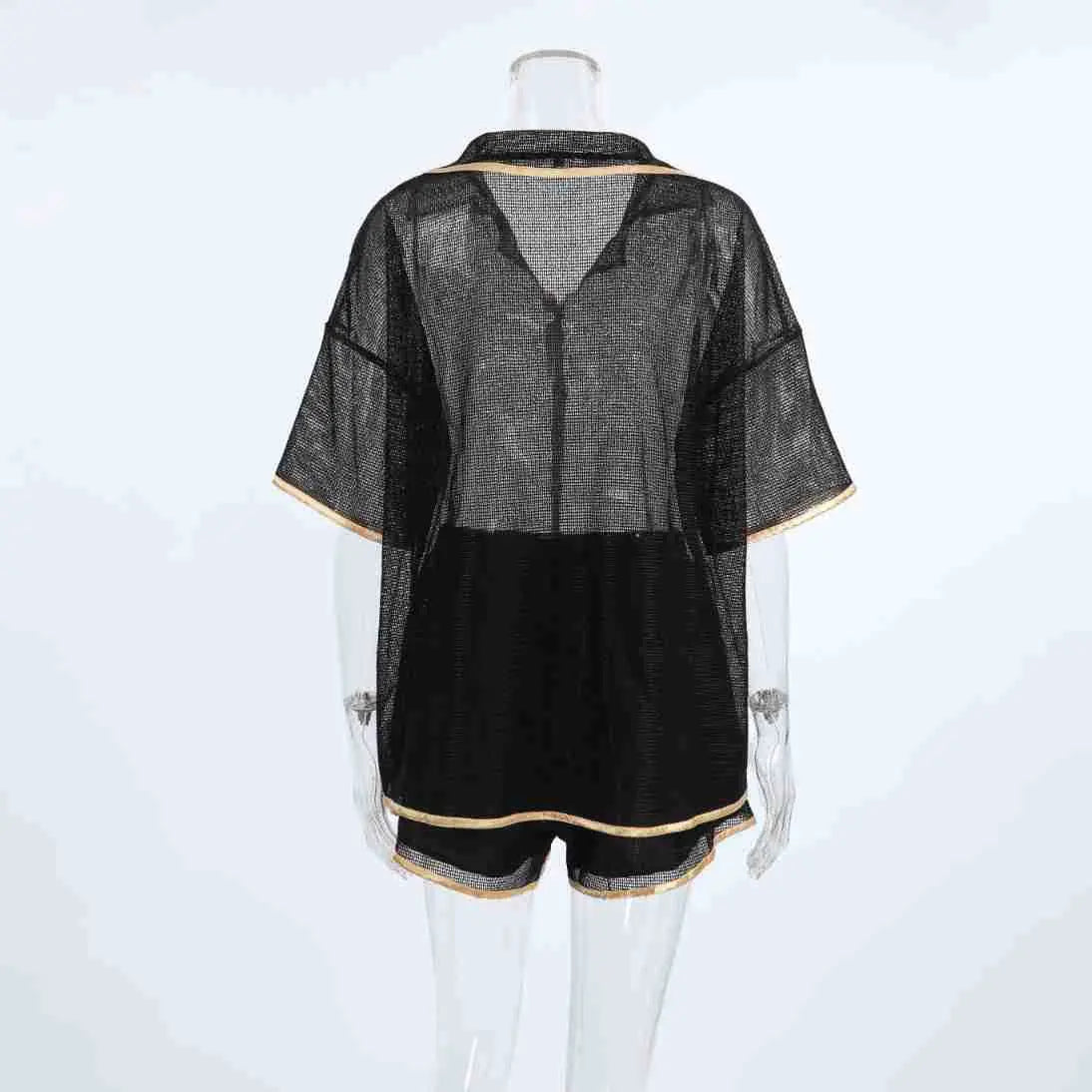 Back view of a black sheer mesh lounge set, featuring an oversized short-sleeved camp collar shirt and matching drawstring shorts, both accented with subtle gold piping.