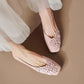 Elegant Blush Rose square toe flats with tonal floral appliques and pearl centers, crafted from vegan leather and gracefully worn.