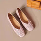 Top-down view of a pair of Blush Rose Khyzet square toe flats, featuring delicate tonal floral appliqués with pearl centers on the vamp.
