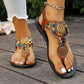 Bohemian brown flat sandals adorned with multicolor beads and golden mandala charms, featuring a braided elastic ankle strap and white-tipped toes.