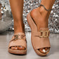 Brevix women's Chic Platform Slides in Elegant Nude, featuring a gold metallic buckle and open-toe design, shown worn with an ankle bracelet on a shimmering background.