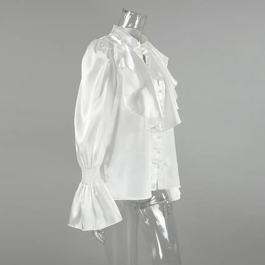 Side view of the Brixen Elegant Satin Blouse in pure white, featuring dramatic front ruffles, a high stand collar, and voluminous trumpet sleeves with smocked cuffs.