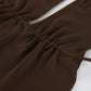 Close-up of a chocolate brown chiffon halter top, showcasing delicate ruching at the bust and a fabric tie strap detail.
