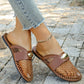 Brown mesh pointed-toe flat mules worn with cropped jeans and a gold anklet, showcasing a chic and breathable summer style with elegant gold hardware.