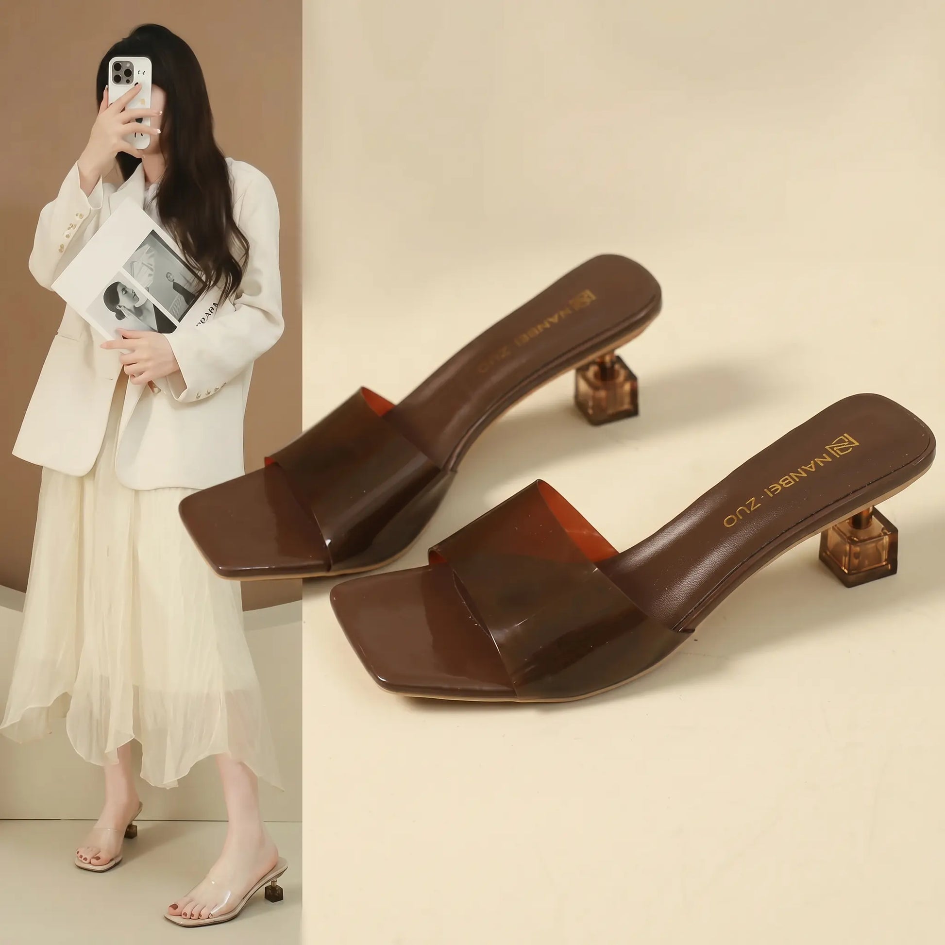 Brown transparent square toe slip-on mule sandals with a clear geometric block heel, showcased from a three-quarter angle.