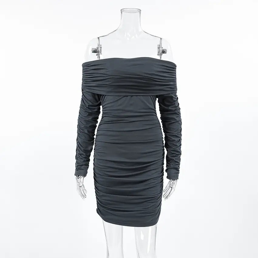 Charcoal grey ruched off-the-shoulder long sleeve mini dress with an asymmetrical draped neckline, shown on a clear mannequin.
