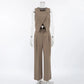Chic beige women's vest and wide-leg trouser set, featuring an asymmetrical crossover vest with shoulder buttons and high-waisted pleated trousers, shown from the front.