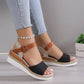 Elarae women's black espadrille wedge sandals with peep toe and adjustable tan faux leather ankle strap, shown worn with jeans.
