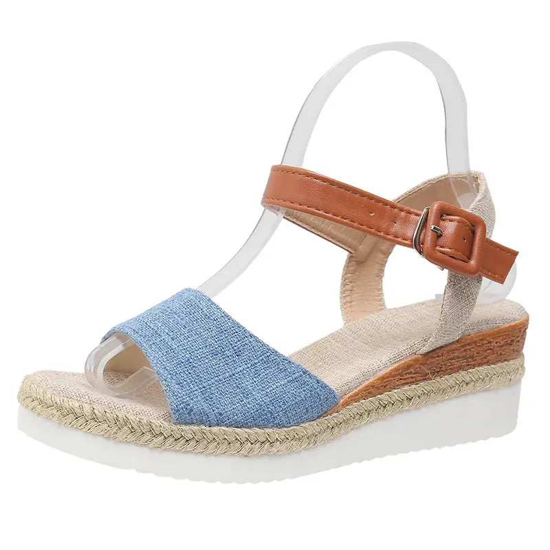 Elarae women's espadrille wedge sandals in classic denim blue linen with a tan faux leather ankle strap and buckle closure, featuring a peep-toe design and white platform sole.