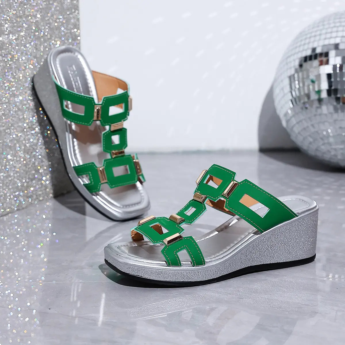 Eskari chic green women's slip-on platform wedge sandals featuring decorative gold geometric hardware and a textured silver wedge heel.
