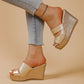 Champagne gold peep-toe mule wedge sandals with intersecting straps and a snake-textured 10cm heel and 4-5cm platform, styled with light-wash jeans.