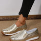 Women's metallic gold woven slip-on loafers worn with black cropped jeans and a gold ankle chain, showcasing the woven texture and comfortable design.