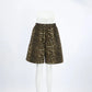 Gyzmar high-rise wide-leg leopard print shorts in warm brown and black, displayed from the front on a white studio background.