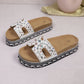 Jelani embellished platform slide sandals with U-shaped straps adorned in mixed beads and rhinestones, featuring a cork footbed and woven midsole detail.