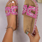 Jelani Fuchsia Bloom embellished platform slide sandals worn on feet, showcasing intricate bead and rhinestone details on the straps and a woven multi-colored midsole. This lifestyle image displays the comfortable cork footbed and open-toe design.