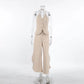Kaelen beige two-piece ensemble featuring a V-neck halter vest with three tonal buttons and flowing wide-leg palazzo trousers with a side split hem.