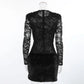 Back view of the Kaelen black lace mini dress, featuring long sheer lace sleeves and a plush faux fur skirt for a striking contrast.
