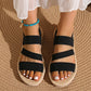 Kaelen women's black elasticated woven strap flat sandals with a fish-mouth open toe and braided sole trim, shown from a top-down perspective.