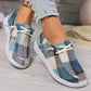 Kaelen women's blue, brown, and cream plaid canvas slip-on loafers with white laces, shown worn with distressed denim on a light wooden floor.