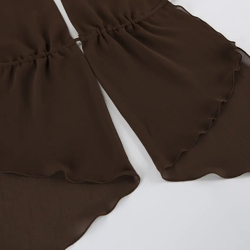 Close-up of a flowy, deep brown chiffon halter top, showcasing its ruffled asymmetrical hemline and delicate gathered fabric details.